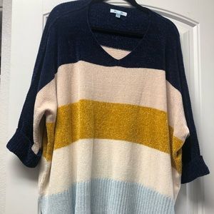 Navy, cream, yellow and light blue sweater.